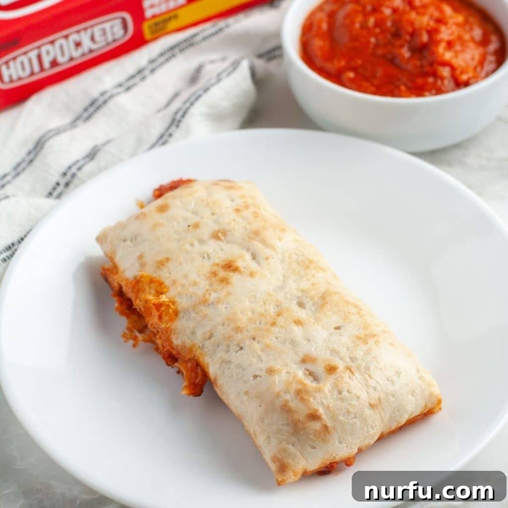 Perfect Hot Pockets Microwave Cook Time 2 A perfectly cooked Hot Pocket, golden brown and steamy, resting on a white plate, ready to be enjoyed.