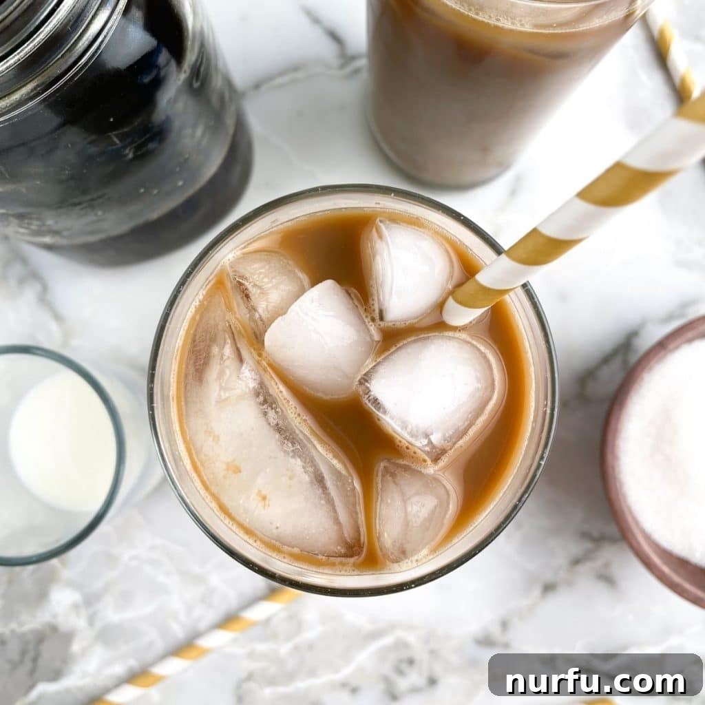 Crafting Perfect Iced Coffee at Home 5 A top-down shot of a refreshing glass of homemade iced coffee, showcasing its inviting layers.
