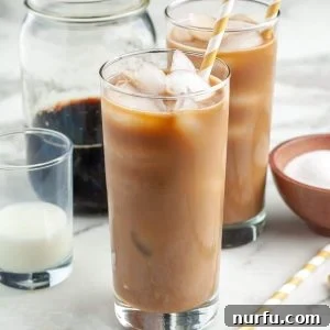 Tall glass of ice coffee.
