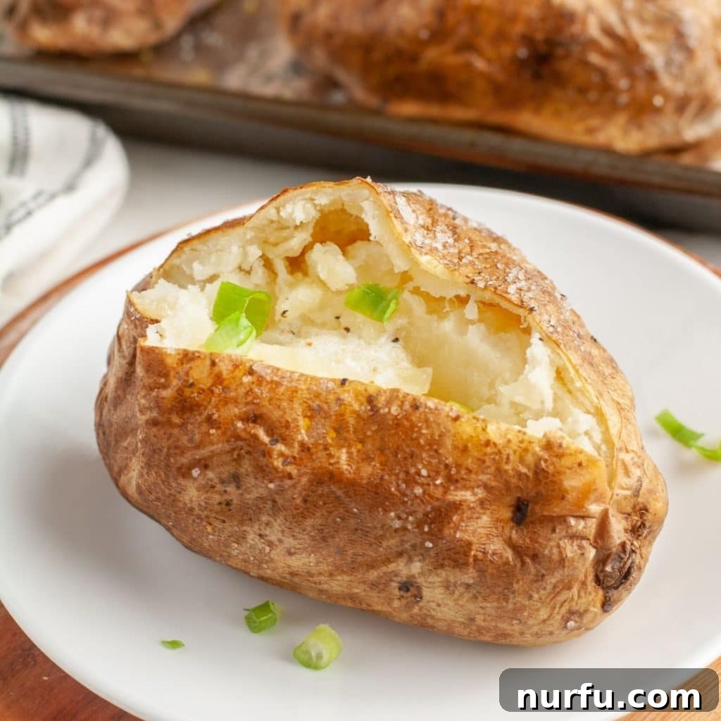 Optimal Potato Bake Time at 400 2 Baked potato on a plate.