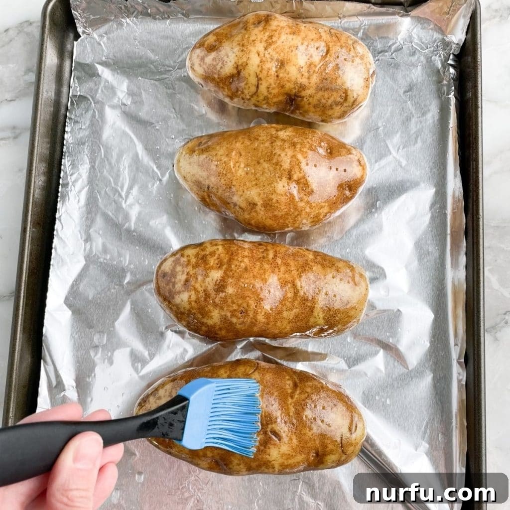 Optimal Potato Bake Time at 400 5 Oil brushing on potatoes.