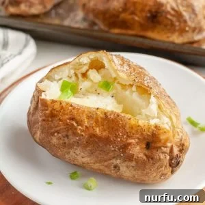 Baked potato on a plate.