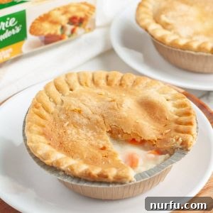 A perfectly cooked pot pie on a plate, showcasing its crispy crust.
