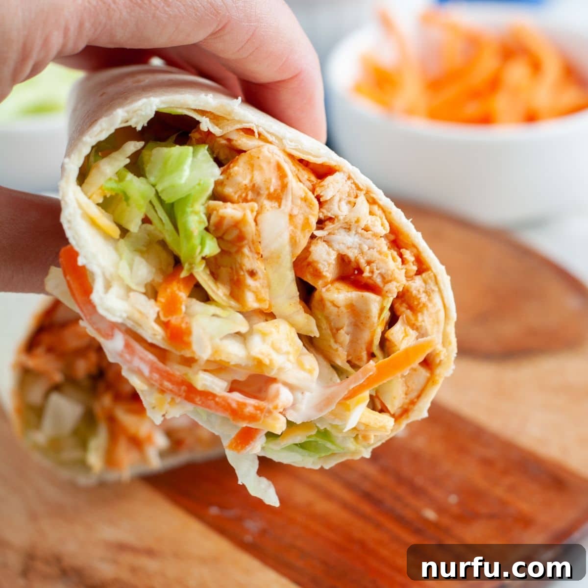 50 Refreshing Cold Lunch Ideas 4 Spicy buffalo chicken wrap filled with fresh ingredients, ready for a flavorful and quick meal.