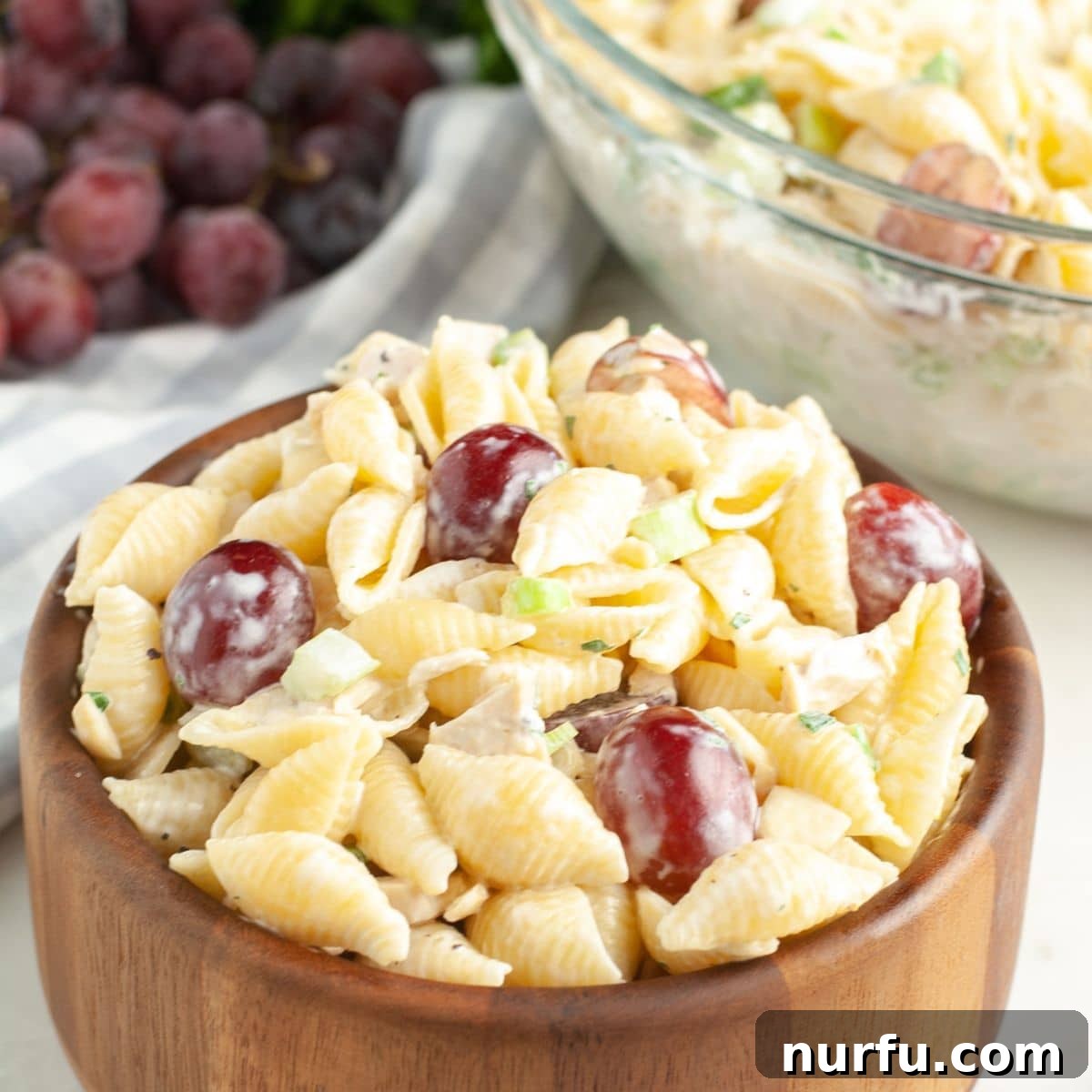 50 Refreshing Cold Lunch Ideas 9 A bowl of creamy chicken pasta salad with grapes, a refreshing and delicious cold dish.