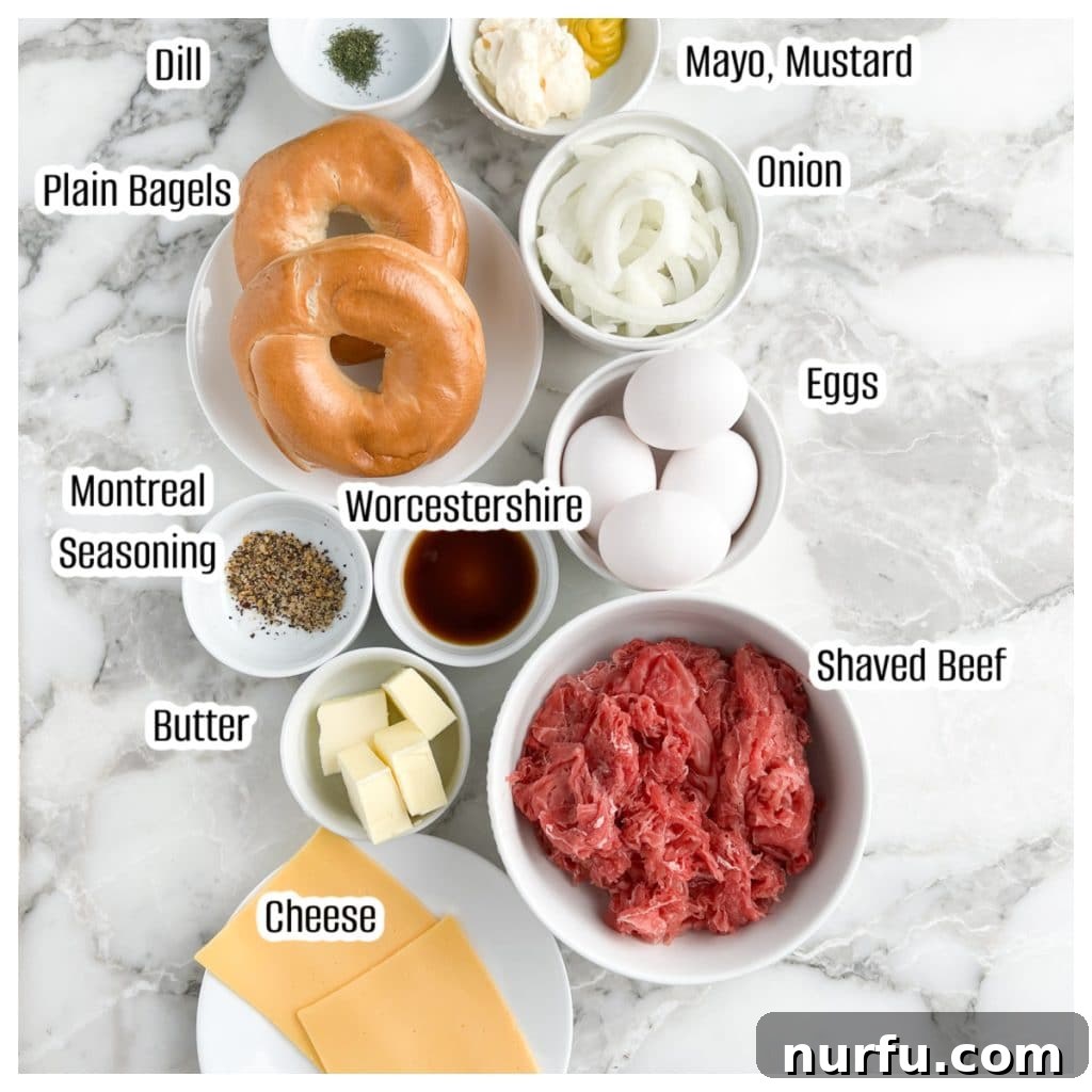 Homemade McDonald's Steak Egg And Cheese Bagel 3 Assorted ingredients laid out for the steak, egg, and cheese bagel recipe including bagels, raw shaved steak, eggs, cheese slices, a white onion, and various spices.