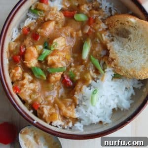 Bayou Shrimp Bliss 2 Shrimp Etoufee in a bowl with spoon.
