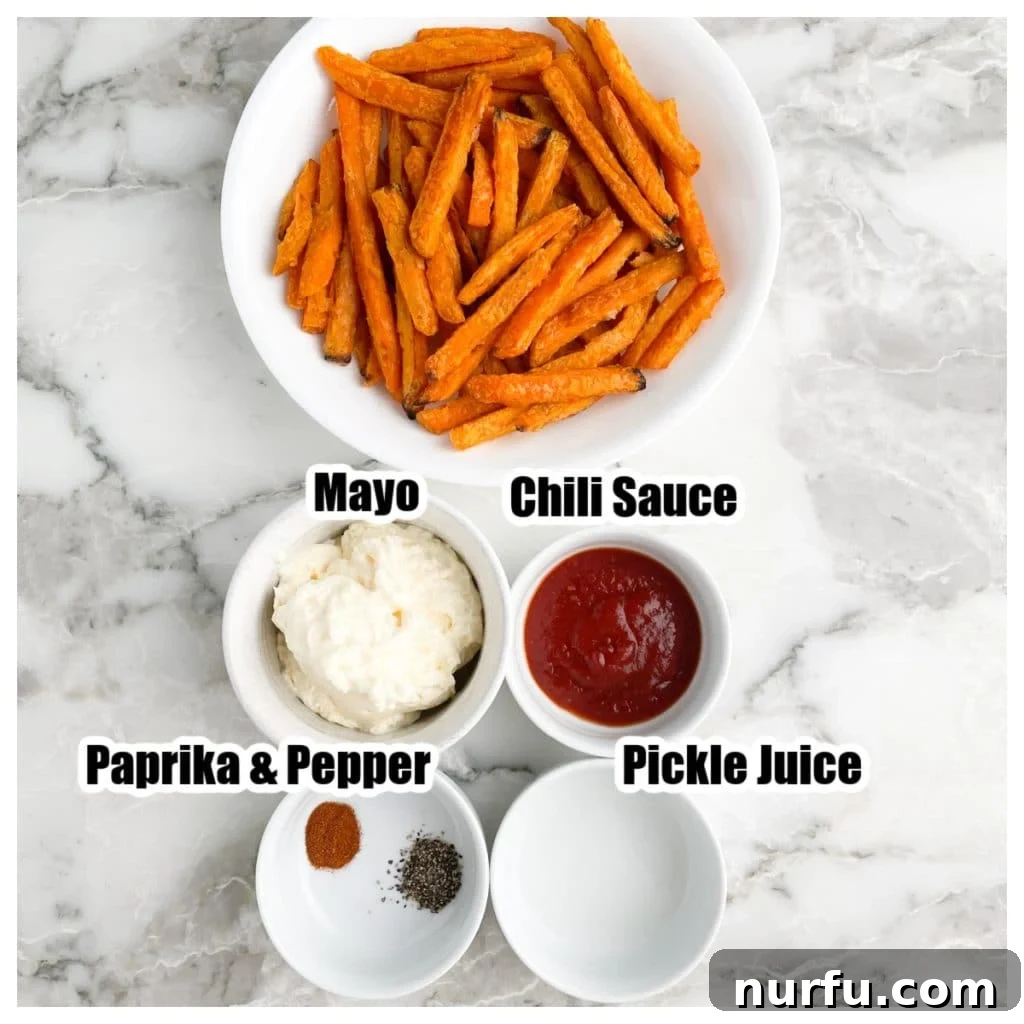 Sweet Potato Fry Dipping Bliss 2 A collection of ingredients for sweet potato fries dipping sauce including mayonnaise, chili sauce, pickle juice, paprika, and ground black pepper in individual bowls on a white surface.