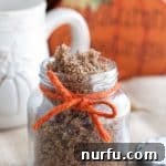 Golden Pumpkin Sugar Polish 8 Sugar scrub in a jar with orange ribbon.