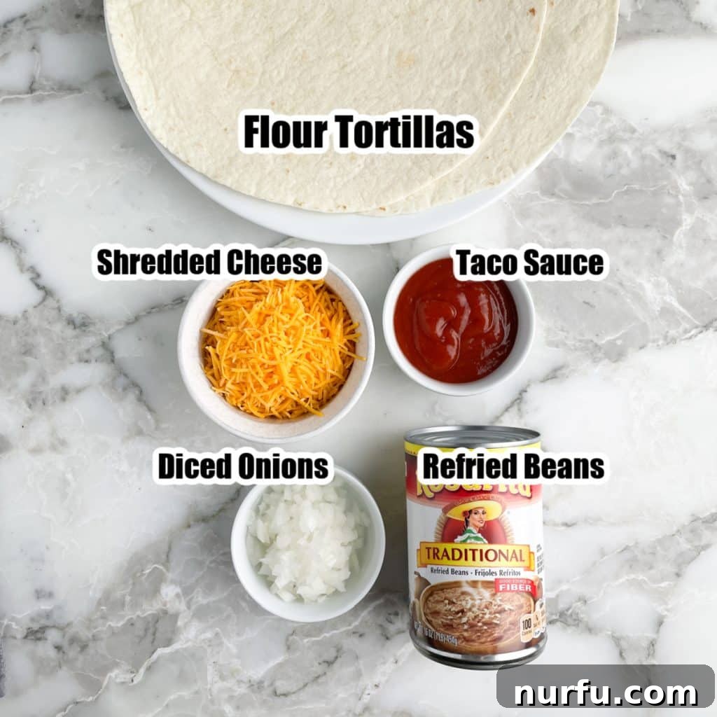 Recreate the Iconic Taco Bell Bean Burrito at Home 3 A selection of ingredients for homemade bean burritos: flour tortillas, a bowl of shredded cheddar cheese, red taco sauce, finely diced onion, and a can of refried beans.