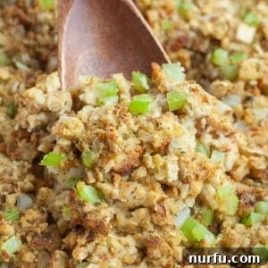 Wooden spoon scooping stuffing.