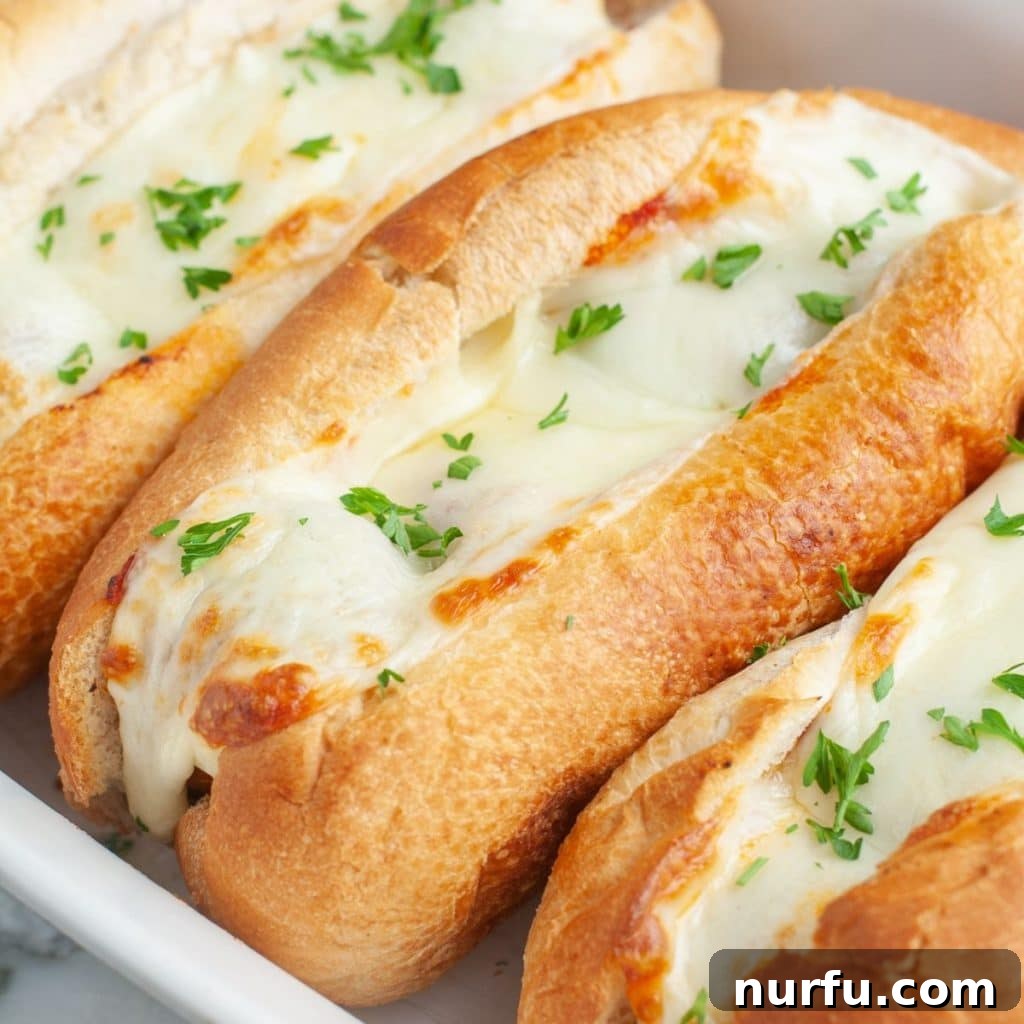 Meatball sandwiches in casserole dish, ready to be served.