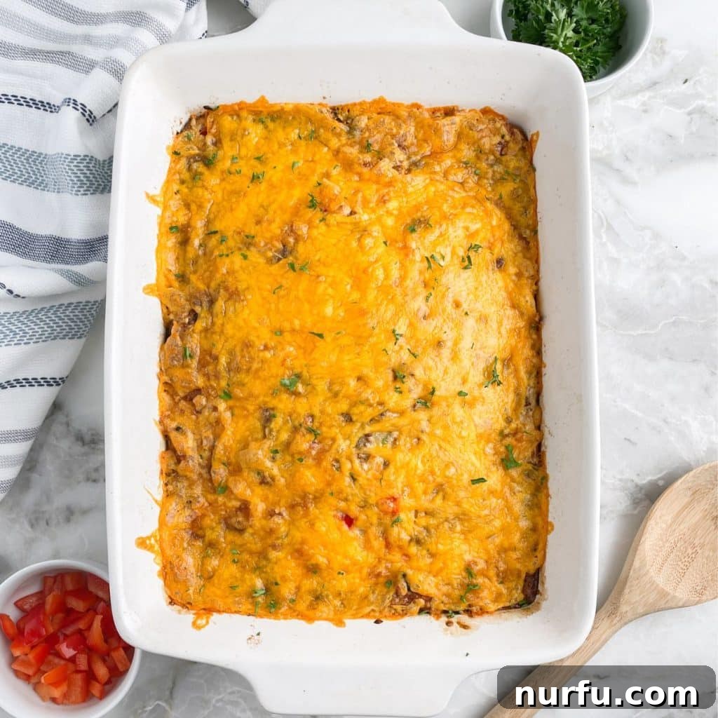 Golden Bisquick Breakfast Delight 7 A full casserole dish of freshly baked Bisquick breakfast casserole, topped with melted cheese, hot and ready to serve.