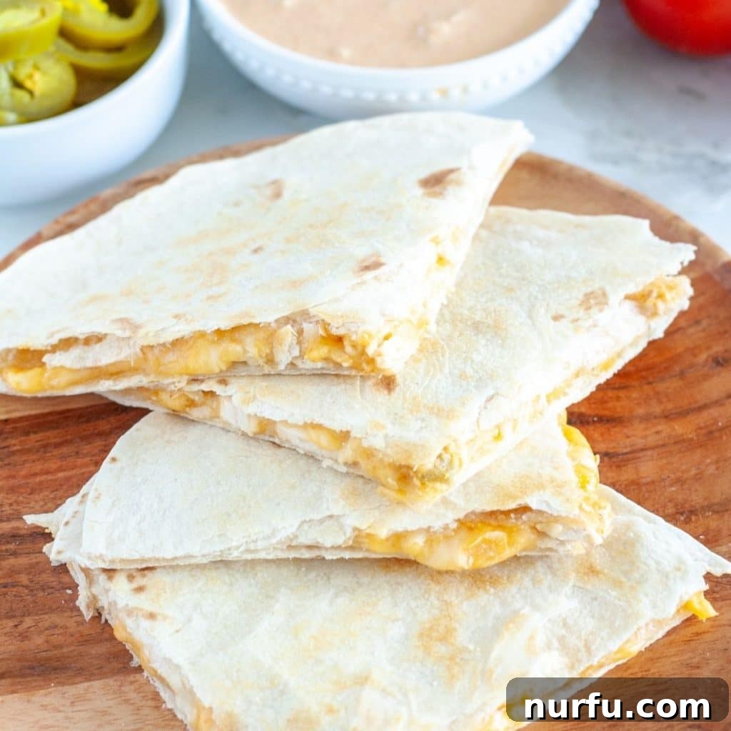 Çili Yanına Ne Yakışır En İyi 27 Eşlikçi Lezzet 12 Crispy quesadillas, cut into perfect triangles, ready to be enjoyed as a flavorful Mexican favorite.
