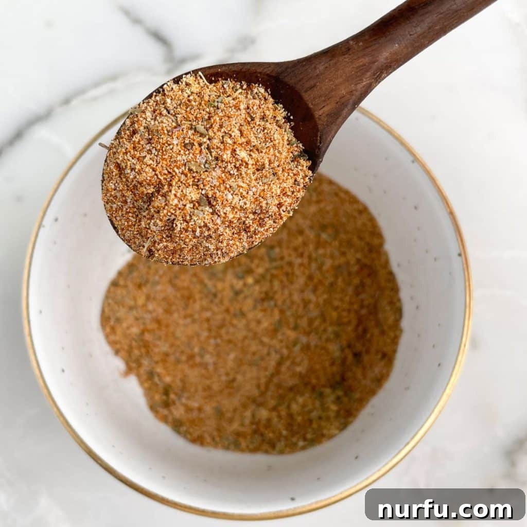 Homemade Meatloaf Spice Blend 2 Bowl and spoon with a perfectly blended meatloaf seasoning mix.