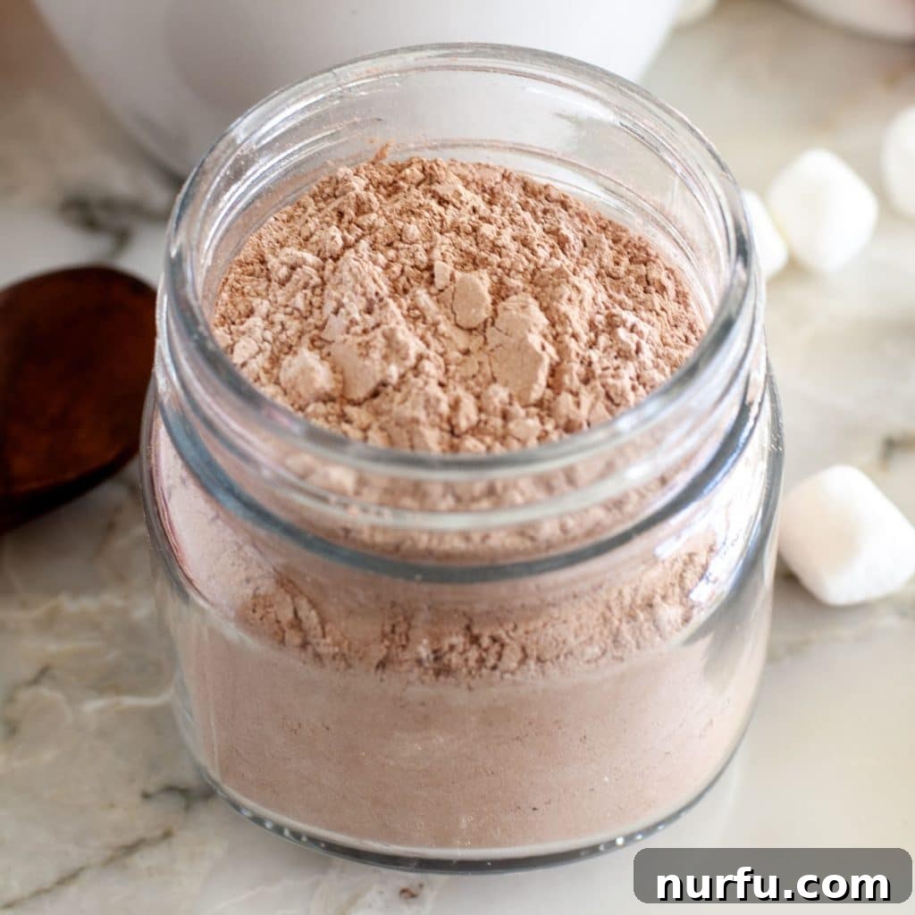 A charming jar brimming with homemade hot chocolate mix, hinting at cozy mornings and sweet indulgences.