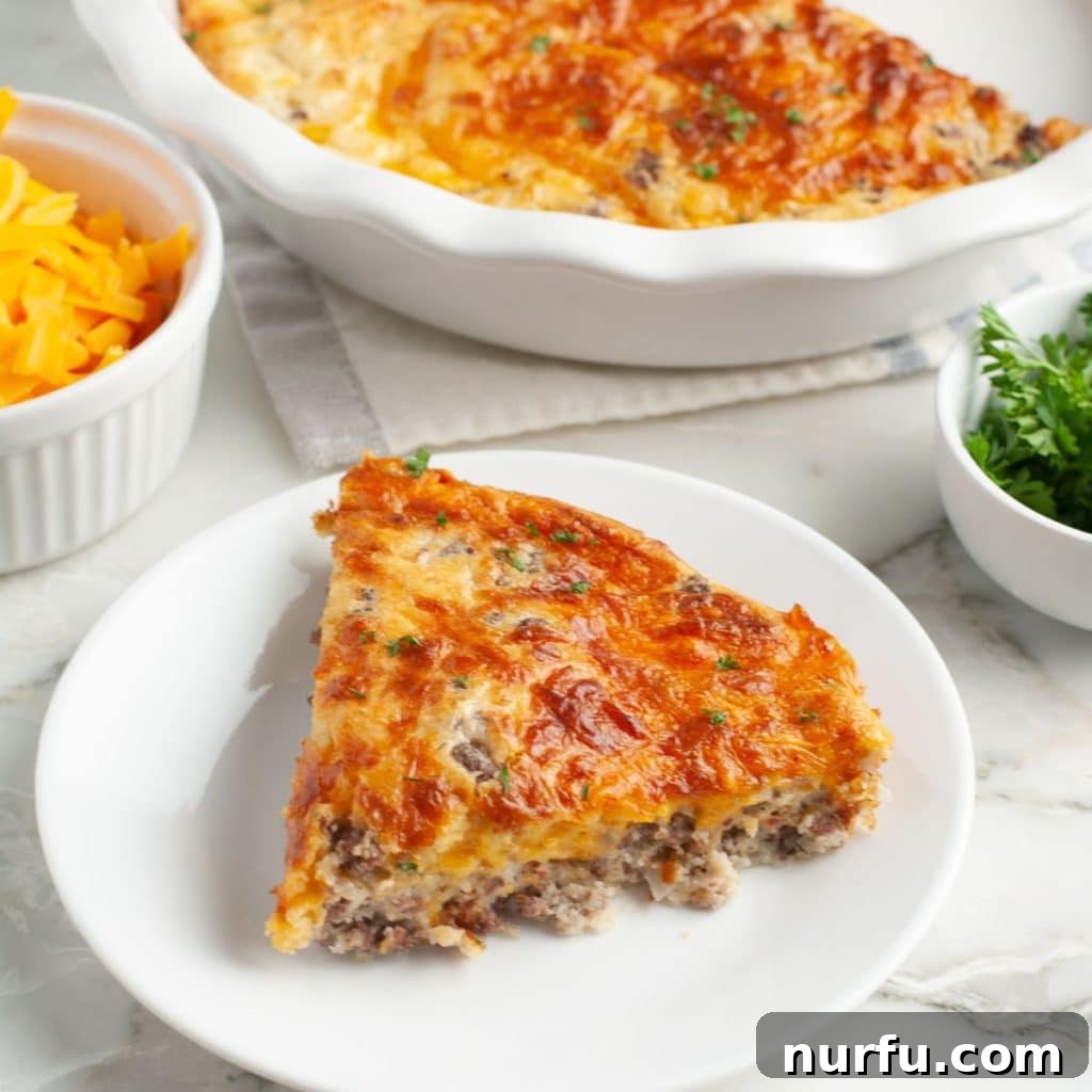 A delectable slice of Bisquick Cheeseburger Pie on a plate, ready to be enjoyed.