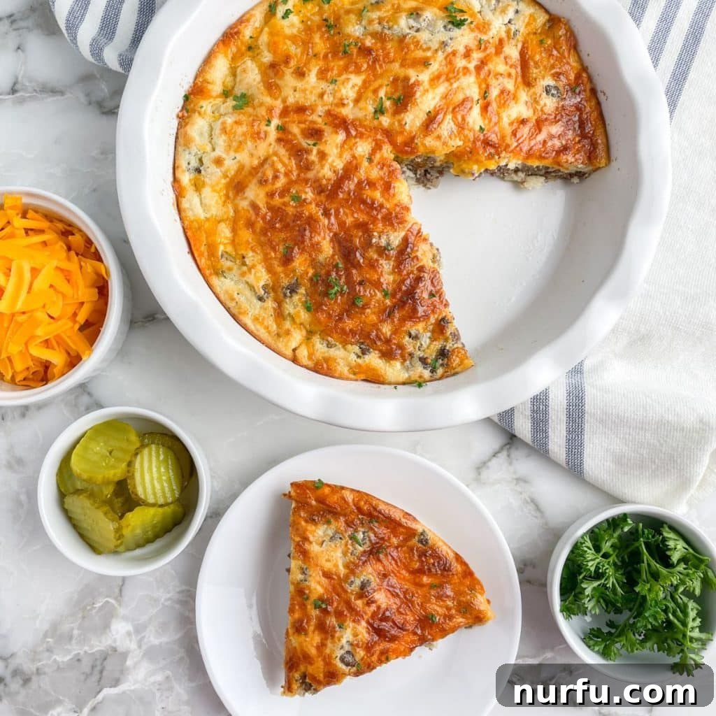 A whole baked Bisquick Cheeseburger Pie in a pie plate and a single slice neatly plated, showcasing its golden crust and hearty filling.