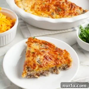 Slice of hamburger pie on a plate.