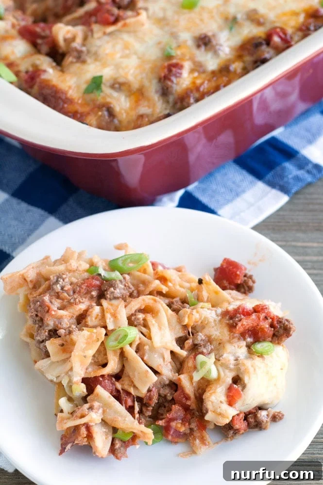 Hearty Ground Beef Pasta Casserole A delicious serving of ground beef pasta casserole on a plate, garnished with fresh parsley.