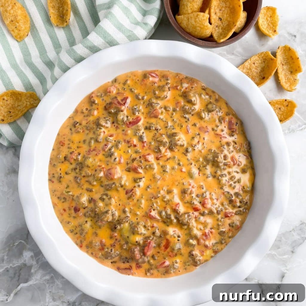 Creamy Velveeta Sausage Dip 7 Plate of cheese dip and corn chips.