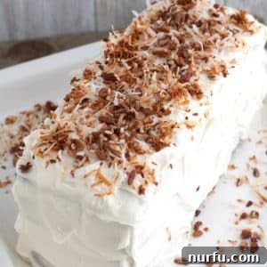 Exotic Coconut Spice Delight 6 Cake with topped with toasted coconut.