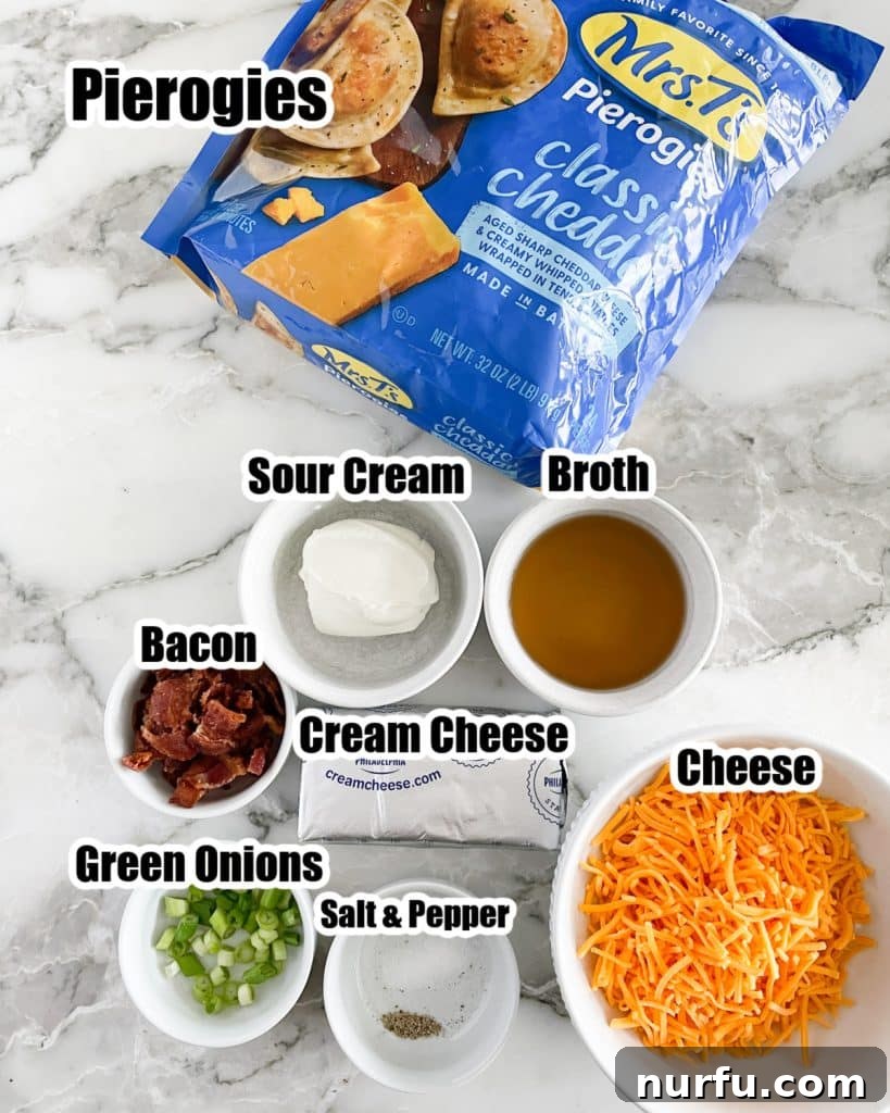 Comforting Pierogi Bake 3 A collection of ingredients laid out, including a bag of frozen pierogies, a bowl of sour cream, chicken broth, crumbled bacon, diced green onions, and shredded cheddar cheese.