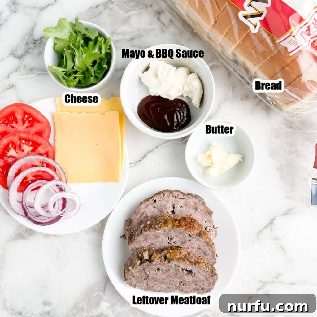 Slices of meatloaf, bread, mayonnaise, lettuce, tomato, and onion.
