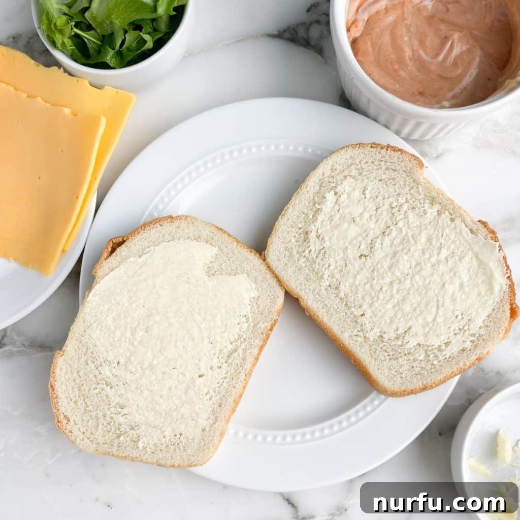 Bread with butter spread on the slices.