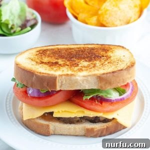 Meatloaf sandwich and bowl of chips.