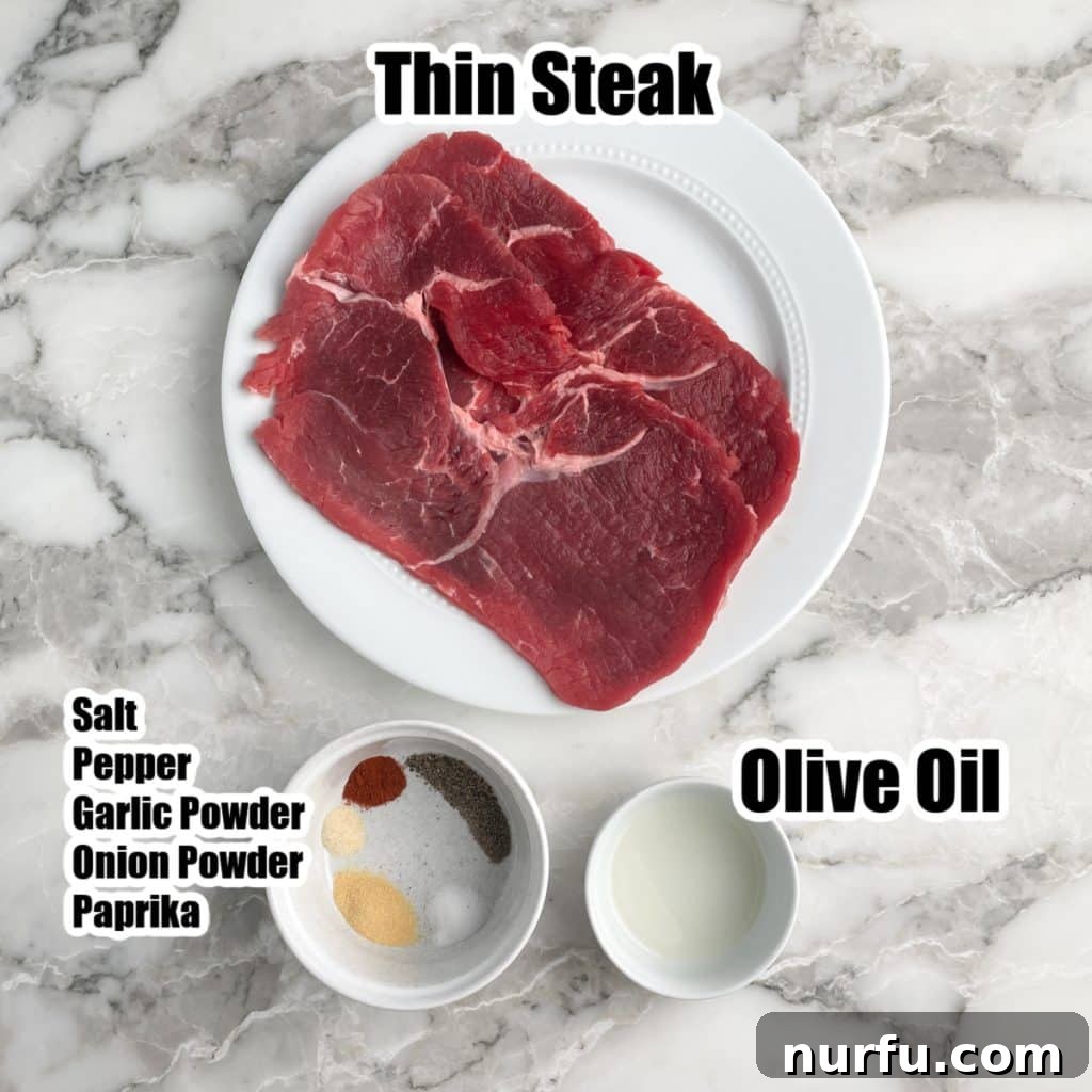 A visual display of the simple ingredients needed for sizzle steak: thin steak, olive oil, and a bowl of mixed spices.