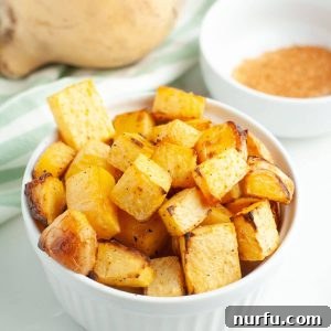 A bowl full of diced, roasted rutabaga.