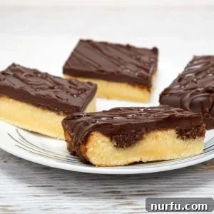 Plate of yellow cake with chocolate frosting.