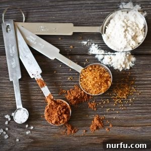Measuring spoons with spices and flour. Accurate measuring tools are key for successful recipes.