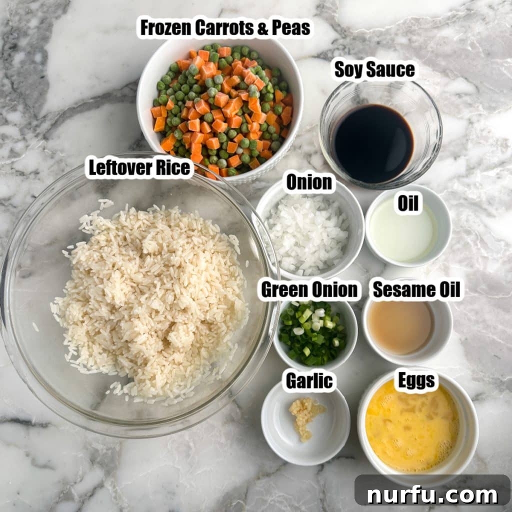 Sheet Pan Fried Rice Magic 3 A collection of fresh and frozen ingredients for sheet pan fried rice: cooked rice, mixed vegetables, soy sauce, onion, eggs, and garlic.