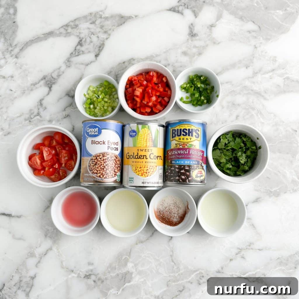 Lone Star Bean Fiesta 3 An array of fresh Texas Caviar ingredients neatly laid out, featuring cans of black-eyed peas, black beans, and corn kernels alongside bowls of vibrant diced bell peppers, green onions, and fresh cilantro, all essential for creating this colorful and flavorful dish.