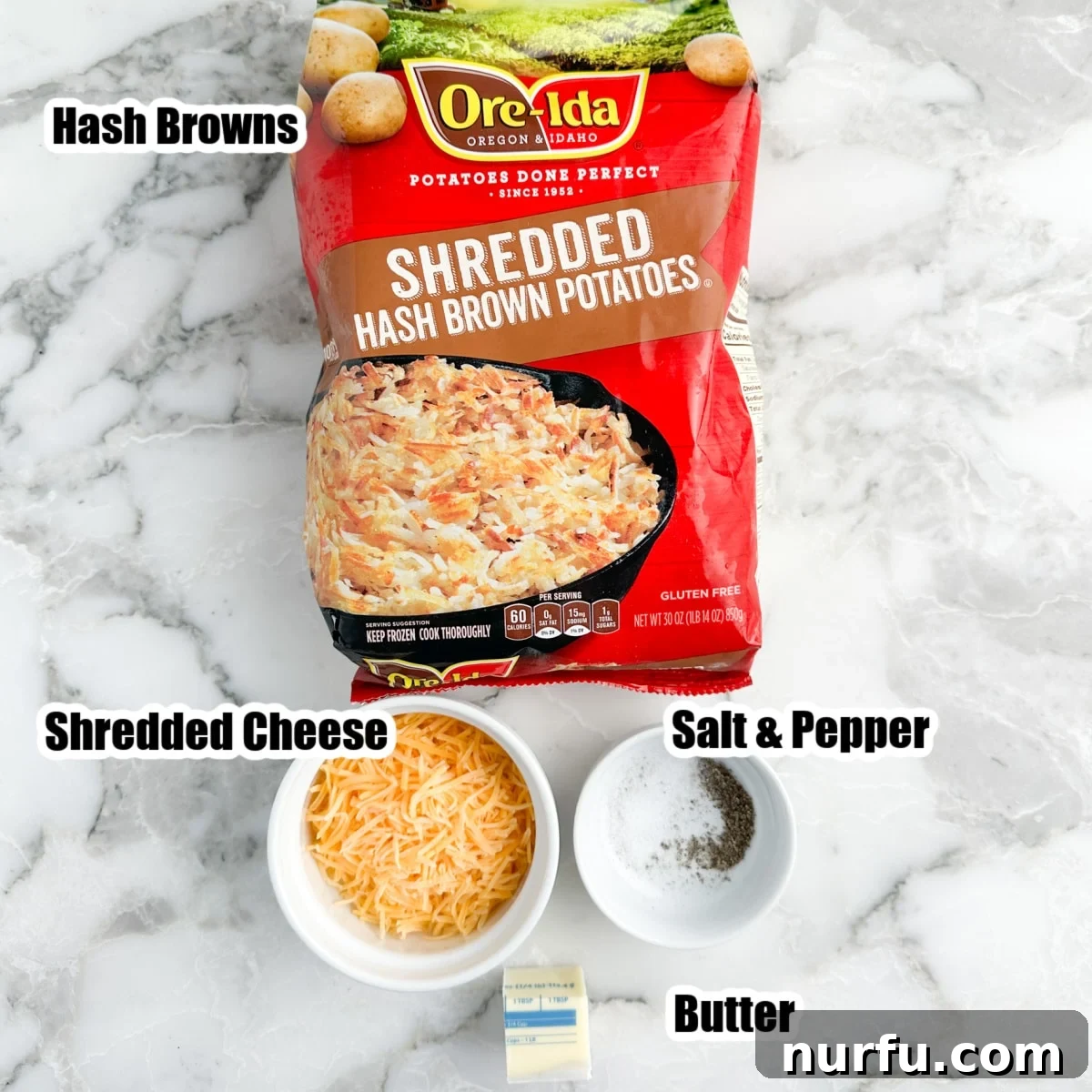 Crispy Waffle Hash Browns 3 A collection of hash brown waffle ingredients: a bag of frozen hash browns, a bowl of shredded cheese, a stick of butter, and small containers of salt and pepper.