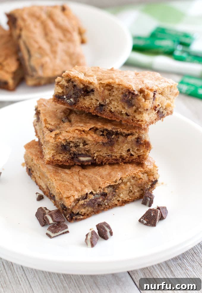 Soft Batch Andes Mint Cookie Bars Close-up of freshly baked cookie bars studded with Andes mint pieces