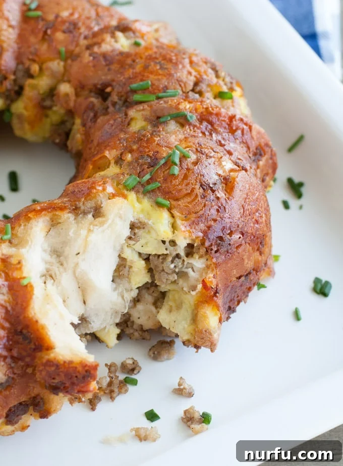 Savory Sausage Egg and Cheese Monkey Bread Bake 2 Close-up of golden brown Sausage, Egg, and Cheese Monkey Bread, ready to be served.