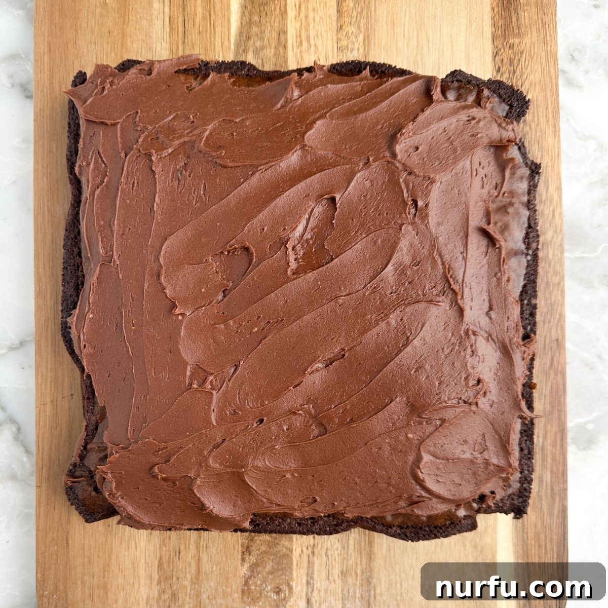 Velvety Brownie Frosting 6 Chocolate frosting on brownies.