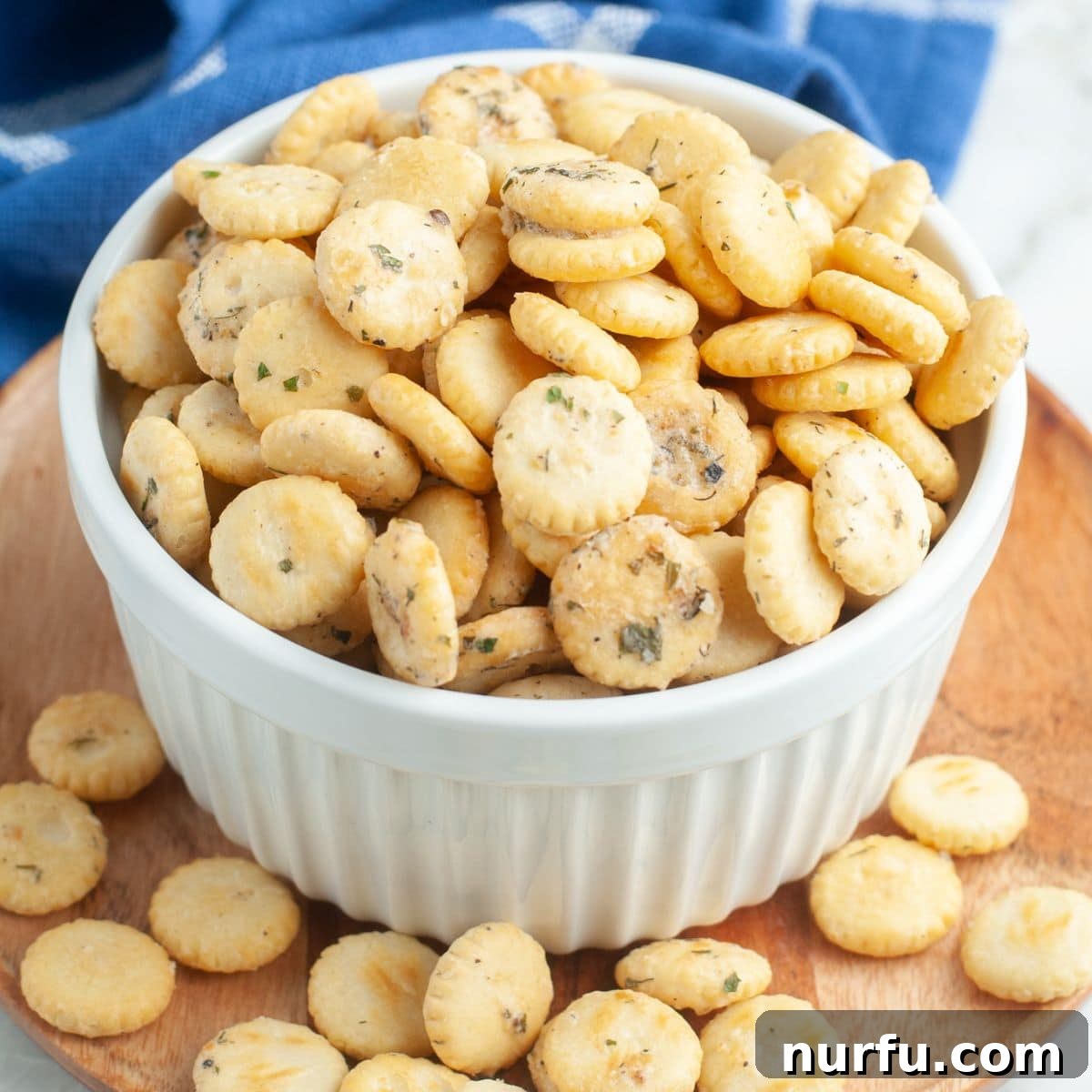 Homemade Savory Oyster Crackers in Minutes 2 Bowl of seasoned oyster crackers, garnished with fresh dill.