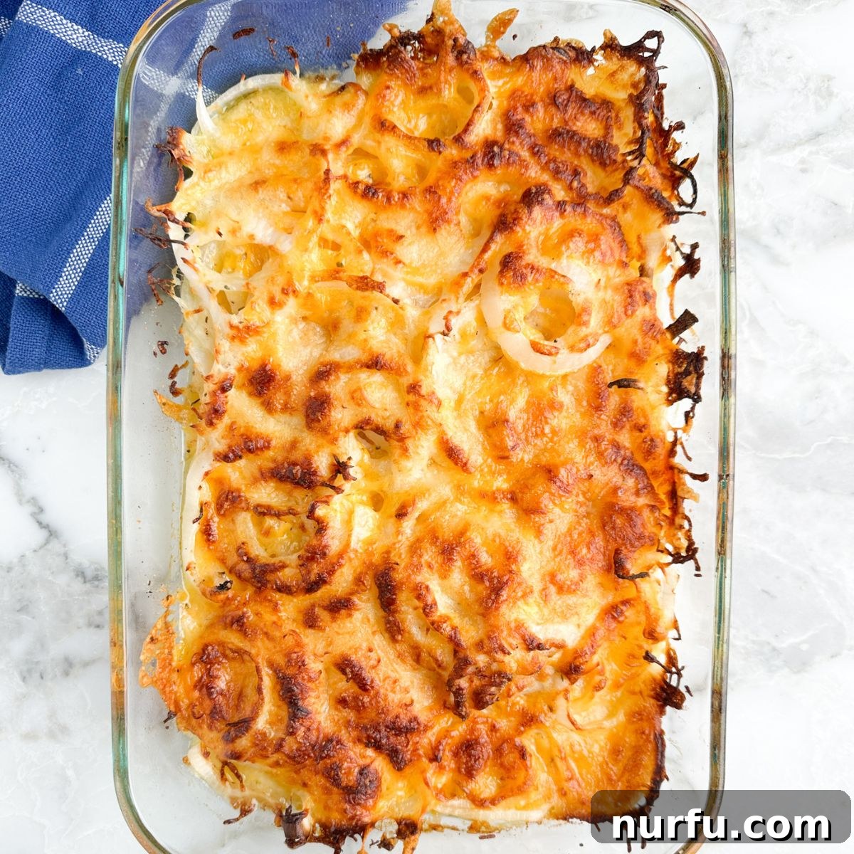 Tennessee's Onions 6 A bubbling hot casserole dish of golden-brown cheesy onions, fresh out of the oven, steam gently rising.