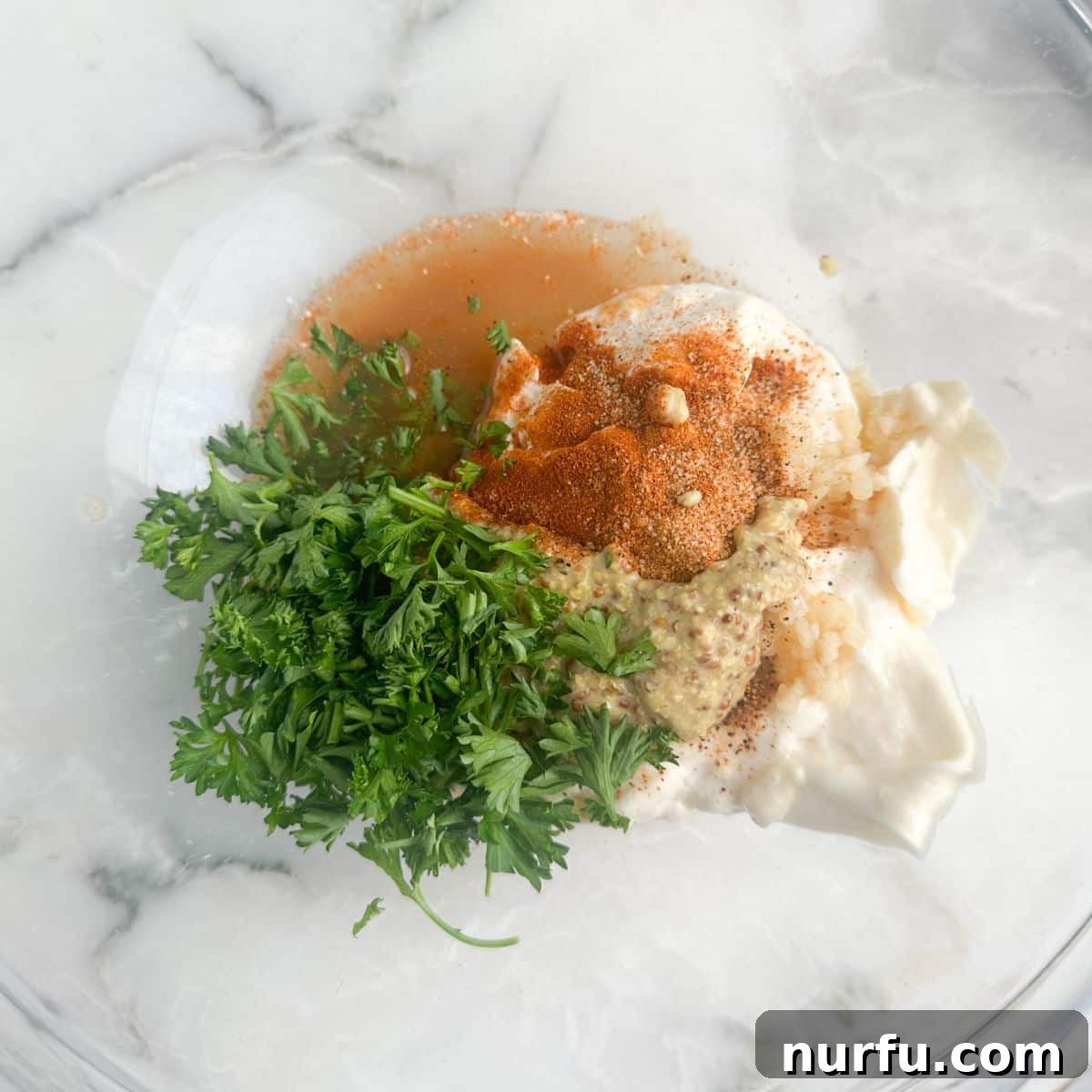 Zesty Homemade Remoulade Sauce 4 Bowl with mayonnaise, seasonings, and fresh parsley.