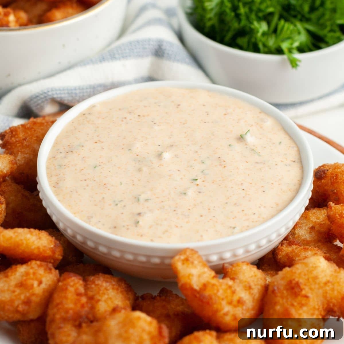 Zesty Homemade Remoulade Sauce 6 Bowl of remoulade sauce with fried shrimp.