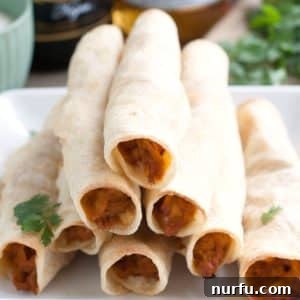 A plate of golden-brown BBQ taquitos, garnished with fresh cilantro, ready to be served.