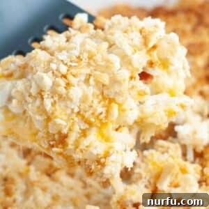 A serving of hash brown chicken casserole on a spatula.