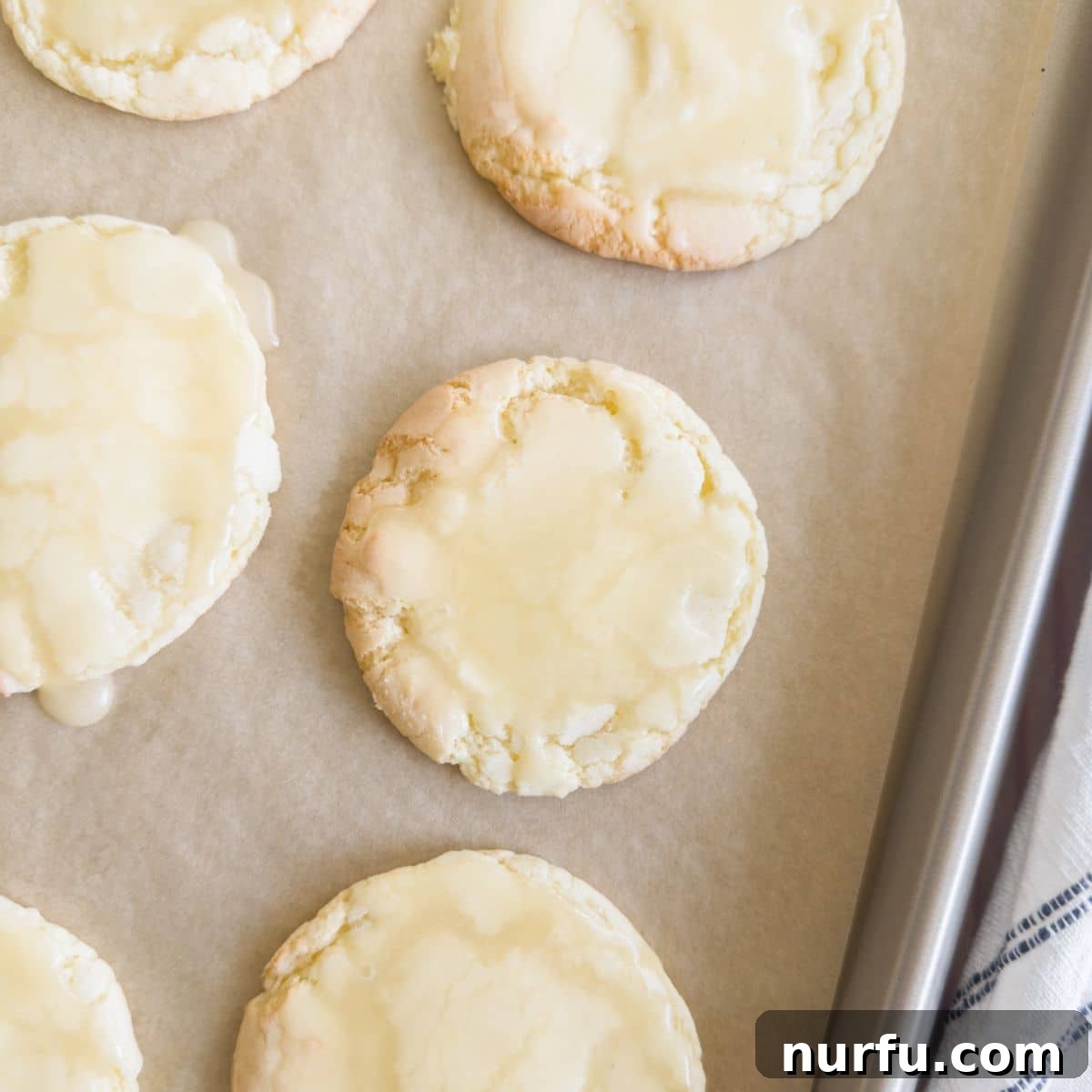 Heavenly Kentucky Butter Cake Cookies 5 Butter cookies with icing on a cookie sheet.