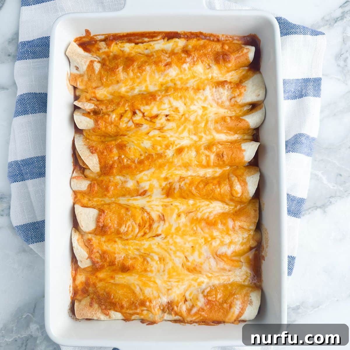 31 Effortless Friday Feasts for a Relaxing Night In 12 Casserole dish with cooked enchiladas.