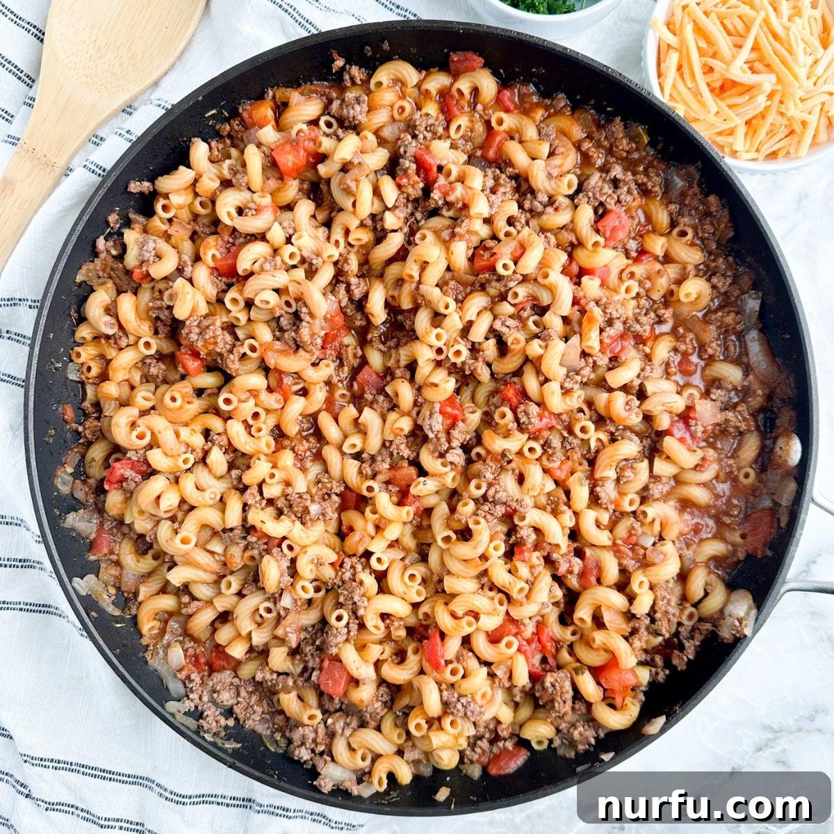 31 Effortless Friday Feasts for a Relaxing Night In 18 Skillet with ground beef, tomatoes, and macaroni.