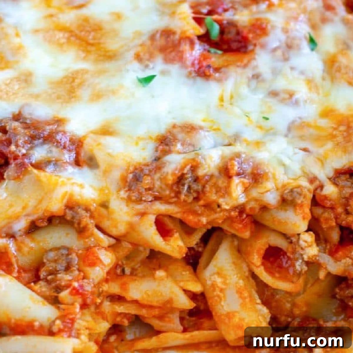 31 Effortless Friday Feasts for a Relaxing Night In 3 Baked pasta with sausage and melted cheese.